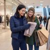 Ololar Flex Series for Shopping Woman wearing full-finger heated gloves while shopping with a friend