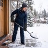 Woman wearing Ololar Shield heated gloves while clearing snow